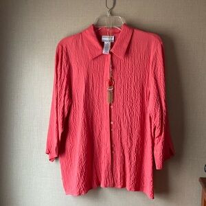 Coral blouse and necklace